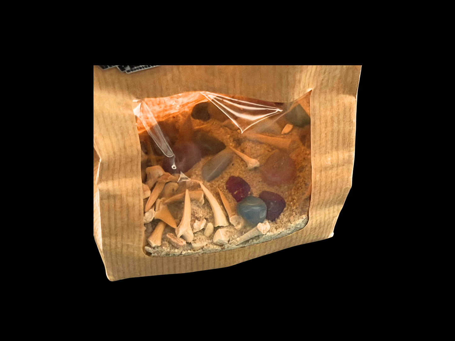 Schatztütchen mit Haifischzähnen und Trommelsteinen