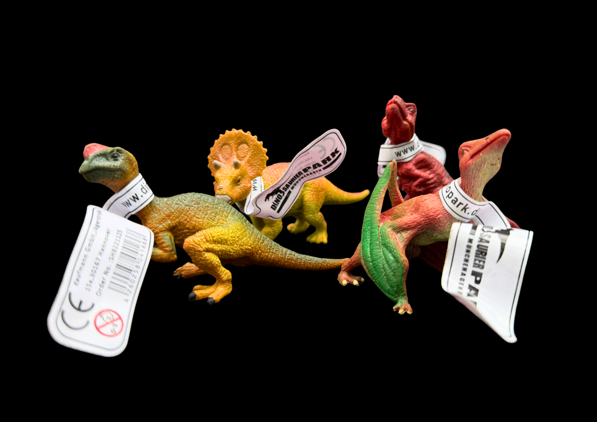 Vier kleine biegbare Dinosaurierfiguren aus Kunststoff im Geschenk-Bundle